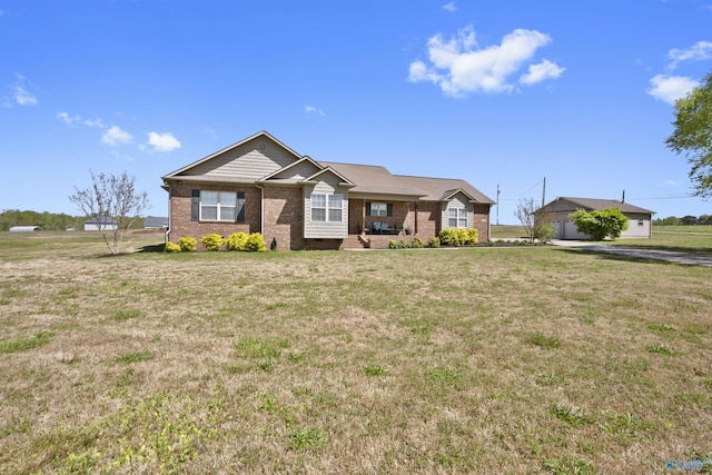 ranch-style house with brick siding and a front lawn