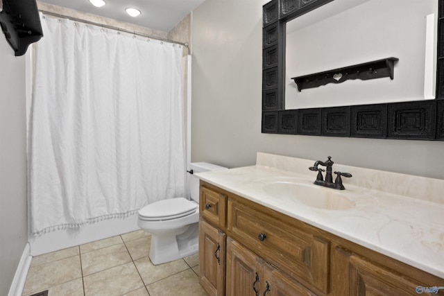 full bath featuring tile patterned flooring, shower / bath combo with shower curtain, toilet, and vanity