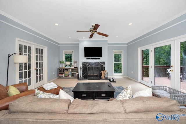 9046 Sugar Tree Trl, Huntsville, AL 35802 - carpeted living room with french doors, ornamental molding, a fireplace, ceiling fan, and recessed lighting