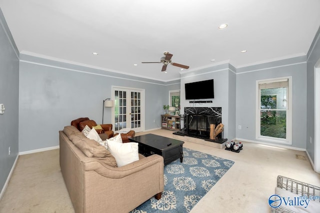 9046 Sugar Tree Trl, Huntsville, AL 35802 - carpeted living room with ceiling fan, a fireplace, ornamental molding, recessed lighting, and french doors