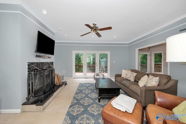 9046 Sugar Tree Trl, Huntsville, AL 35802 - living room with ceiling fan, plenty of natural light, a high end fireplace, and crown molding