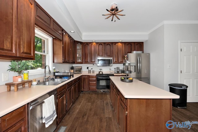 9046 Sugar Tree Trl, Huntsville, AL 35802 - kitchen with stainless steel appliances, dark wood finished floors, a kitchen island, light countertops, and crown molding