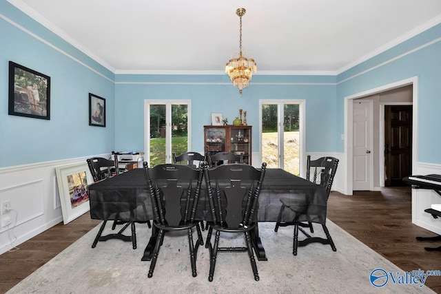 9046 Sugar Tree Trl, Huntsville, AL 35802 - dining space with plenty of natural light, ornamental molding, a wainscoted wall, a chandelier, and wood finished floors