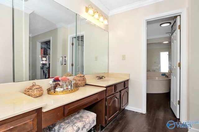 9046 Sugar Tree Trl, Huntsville, AL 35802 - full bath featuring ornamental molding, wood finished floors, vanity, a bath, and a walk in closet
