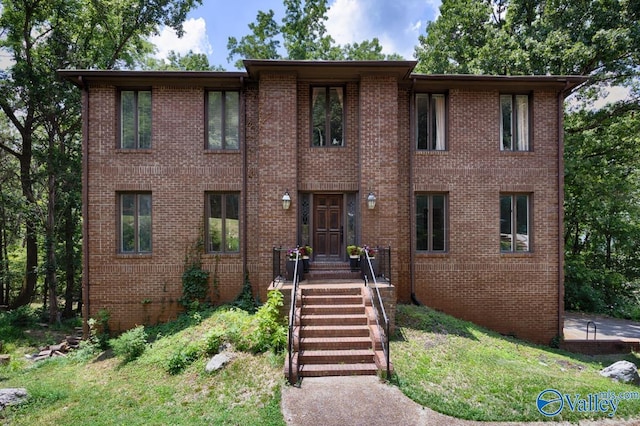 9046 Sugar Tree Trl, Huntsville, AL 35802 - colonial home with brick siding and a front lawn