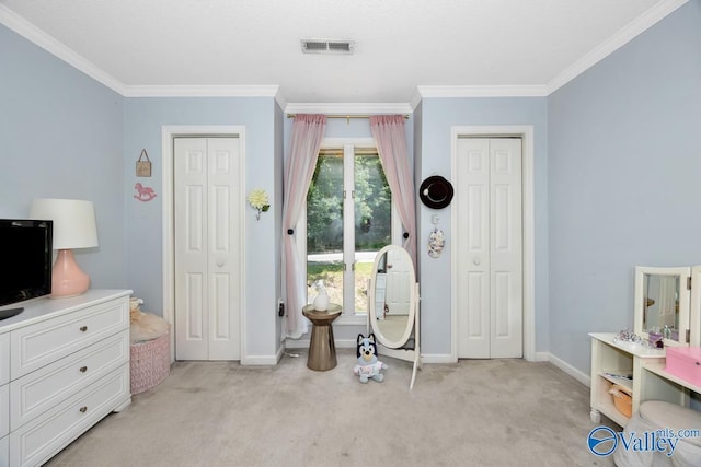 9046 Sugar Tree Trl, Huntsville, AL 35802 - bedroom featuring two closets, light carpet, and ornamental molding