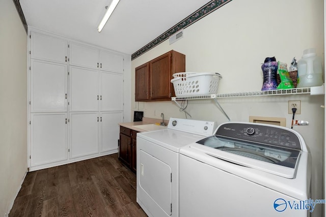 9046 Sugar Tree Trl, Huntsville, AL 35802 - laundry room with cabinet space, independent washer and dryer, and dark wood-type flooring