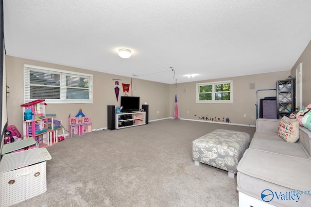 9046 Sugar Tree Trl, Huntsville, AL 35802 - carpeted living area with a textured ceiling and baseboards