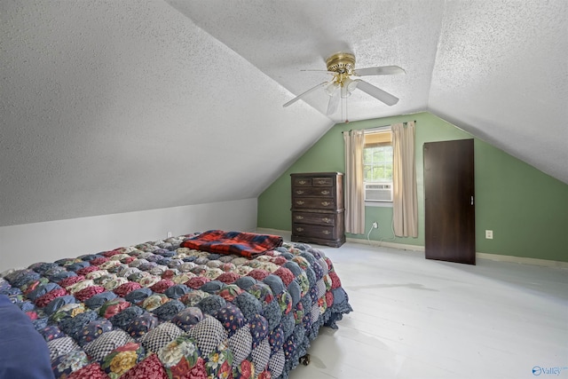 bedroom featuring a ceiling fan, cooling unit, lofted ceiling, and a textured ceiling