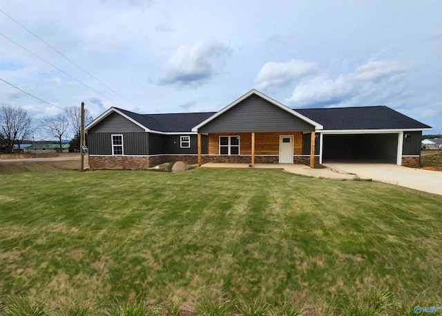 ranch-style home featuring a garage and a front lawn