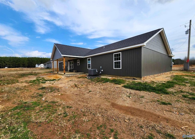 rear view of property with central air condition unit