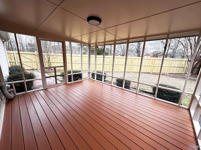 unfurnished sunroom featuring a wealth of natural light