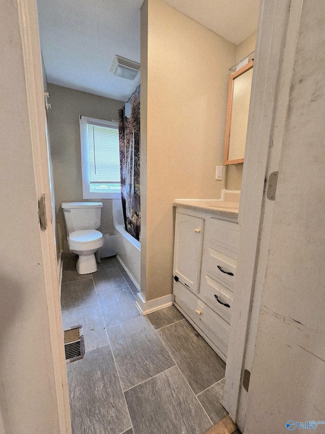 bathroom with vanity, toilet, tile patterned floors, shower / tub combo, and visible vents