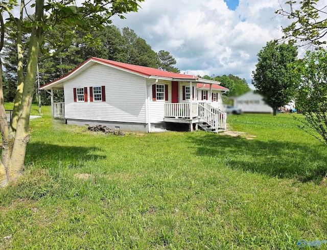 view of front facade with a front lawn and crawl space