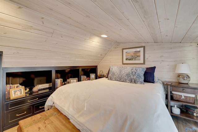 bedroom with wood ceiling, wood walls, dark wood-type flooring, and vaulted ceiling