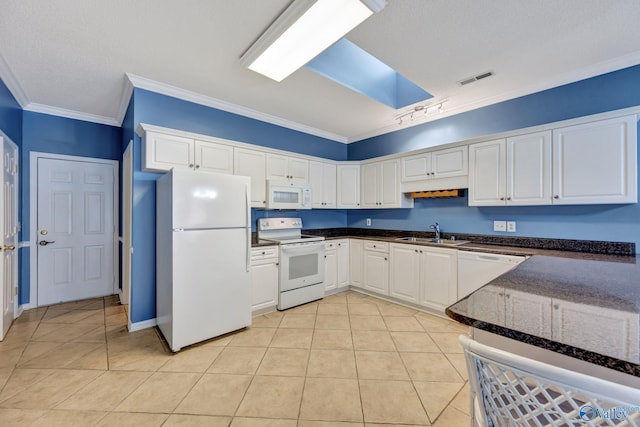 kitchen featuring white appliances, sink, ornamental molding, light tile patterned flooring, and white cabinetry