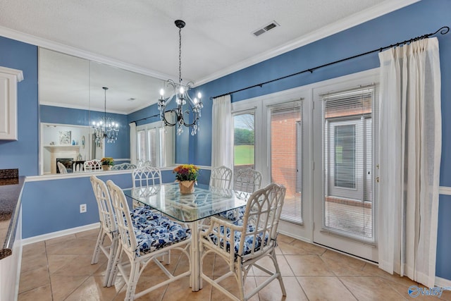 dining room featuring light tile patterned floors, a textured ceiling, an inviting chandelier, and crown molding