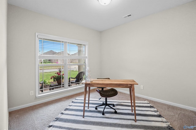 office featuring baseboards, visible vents, and carpet floors