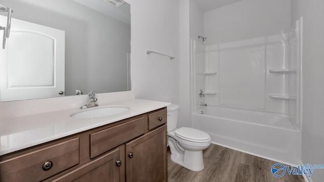 full bathroom with toilet, vanity, bathtub / shower combination, and wood finished floors