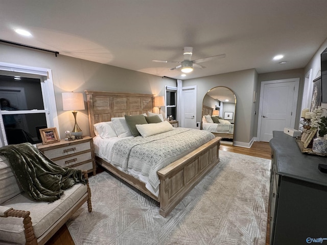 bedroom featuring light wood-type flooring and ceiling fan