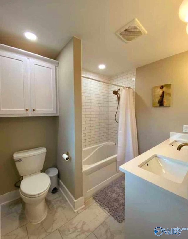 full bathroom with toilet, shower / tub combo with curtain, and sink