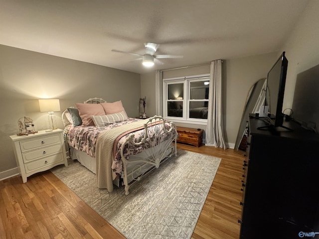 bedroom featuring ceiling fan and light hardwood / wood-style flooring