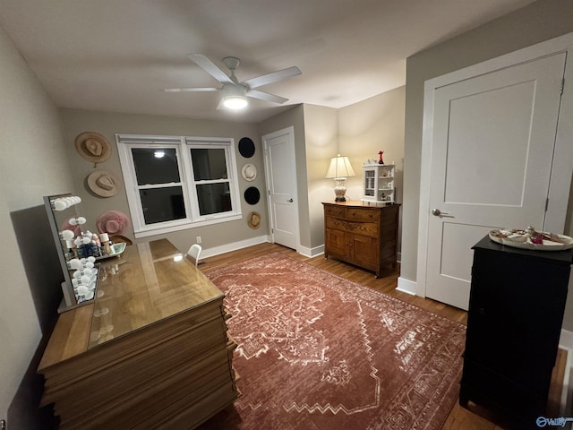 bedroom with hardwood / wood-style floors and ceiling fan