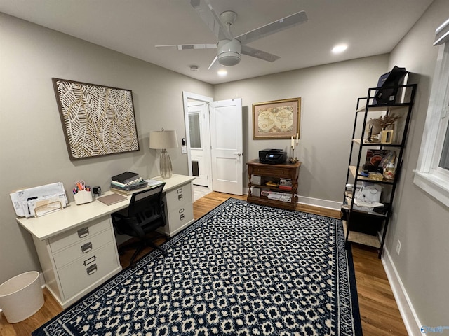 home office featuring ceiling fan and light hardwood / wood-style floors