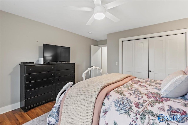 bedroom with ceiling fan, a closet, and hardwood / wood-style floors