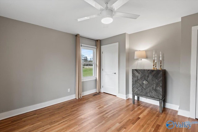 interior space with hardwood / wood-style flooring and ceiling fan