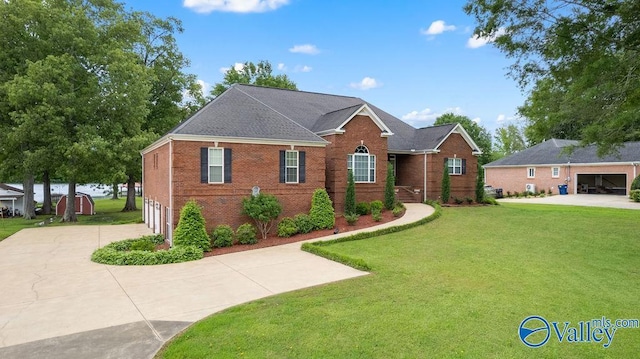 219 Sharp Dr, Gadsden, AL 35903 - view of front of property with brick siding, driveway, and a front yard