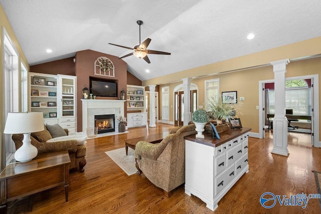 219 Sharp Dr, Gadsden, AL 35903 - living area featuring ornate columns, a fireplace with flush hearth, ceiling fan, vaulted ceiling, and recessed lighting