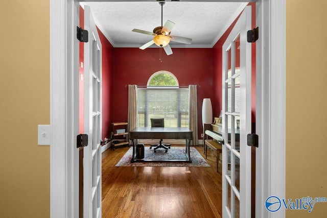219 Sharp Dr, Gadsden, AL 35903 - office space with french doors, wood finished floors, a textured ceiling, a ceiling fan, and crown molding