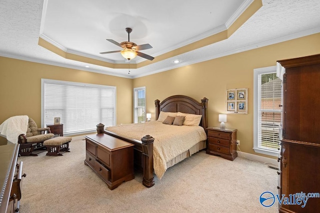 219 Sharp Dr, Gadsden, AL 35903 - bedroom featuring a raised ceiling, light colored carpet, crown molding, baseboards, and a ceiling fan
