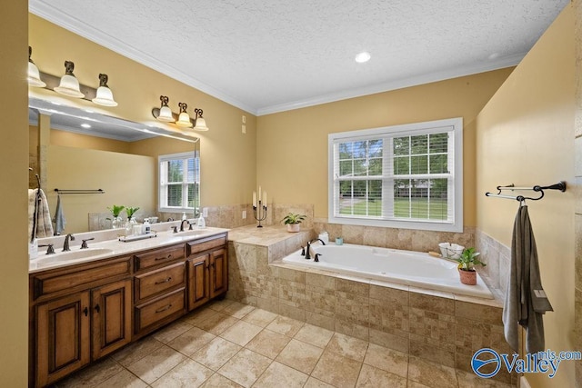 219 Sharp Dr, Gadsden, AL 35903 - full bathroom featuring a bath, double vanity, a textured ceiling, crown molding, and tile patterned flooring