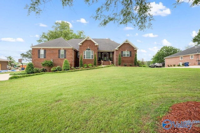 219 Sharp Dr, Gadsden, AL 35903 - view of front of home with brick siding and a front lawn