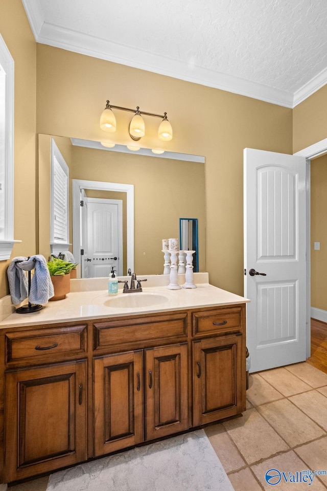 219 Sharp Dr, Gadsden, AL 35903 - bathroom with crown molding, vanity, and tile patterned floors