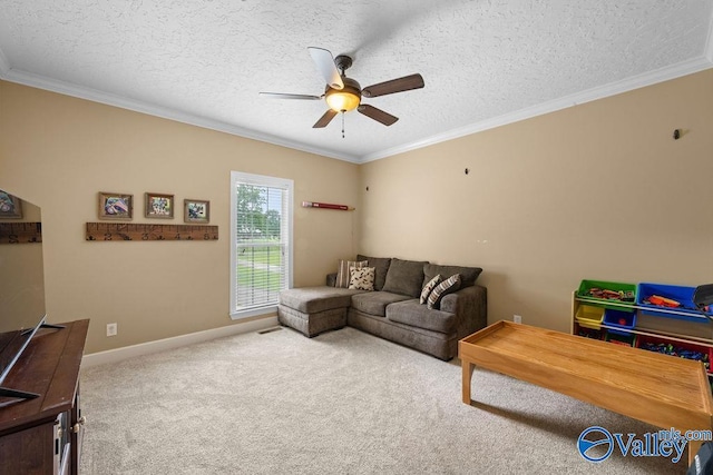 219 Sharp Dr, Gadsden, AL 35903 - carpeted living room featuring ceiling fan, a textured ceiling, ornamental molding, and baseboards