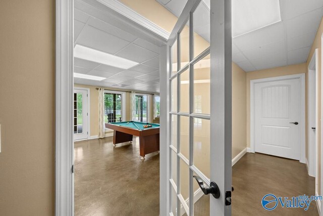 219 Sharp Dr, Gadsden, AL 35903 - playroom featuring concrete floors, a paneled ceiling, billiards table, and baseboards