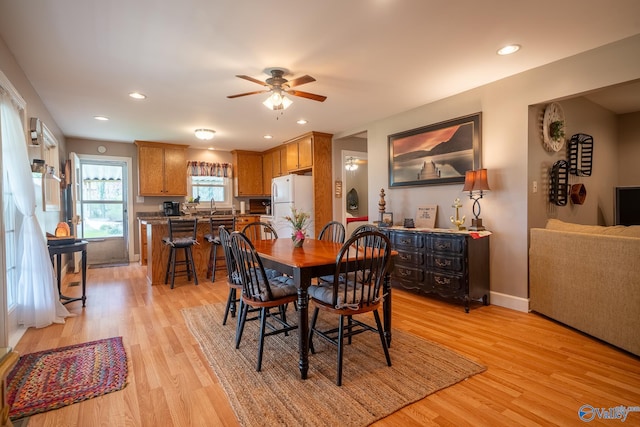 dining room with a ceiling fan, recessed lighting, baseboards, and light wood-type flooring