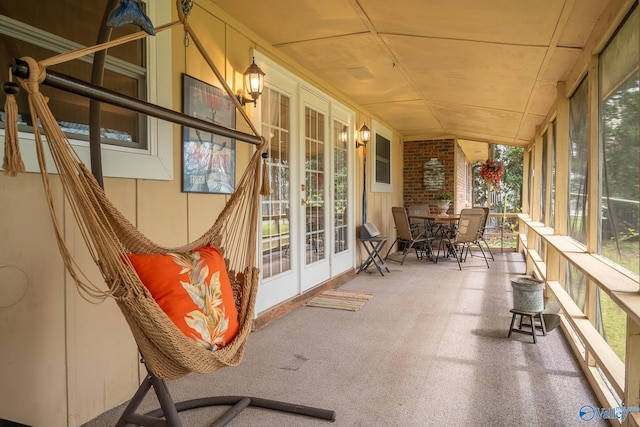 unfurnished sunroom featuring french doors and a wall of windows