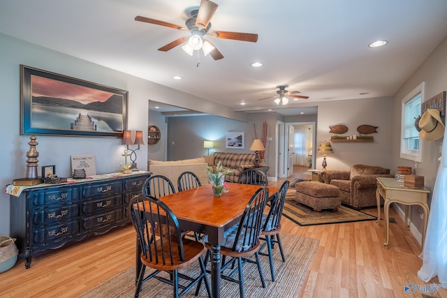 dining space with light wood-type flooring, recessed lighting, and a ceiling fan