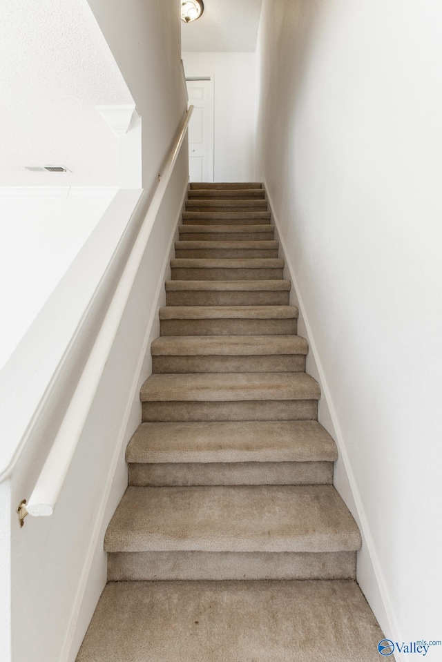 stairway with baseboards