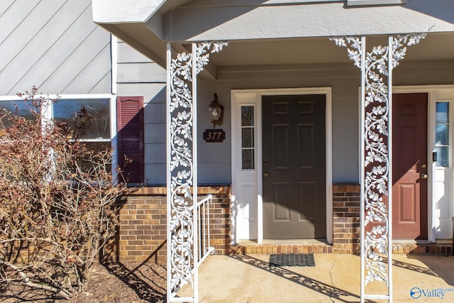 property entrance with brick siding