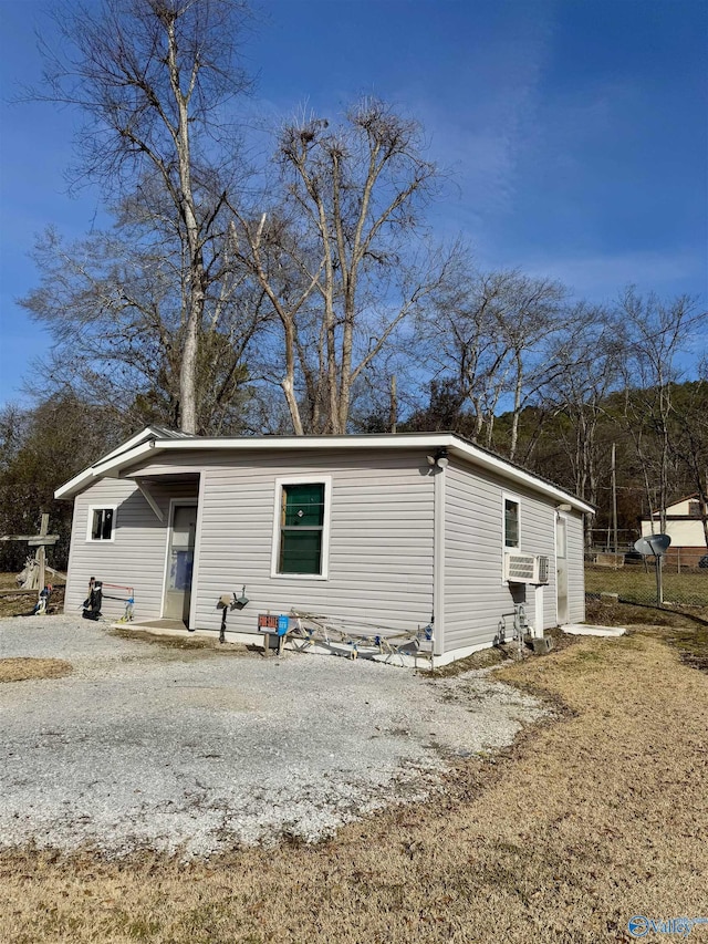 view of side of home with cooling unit