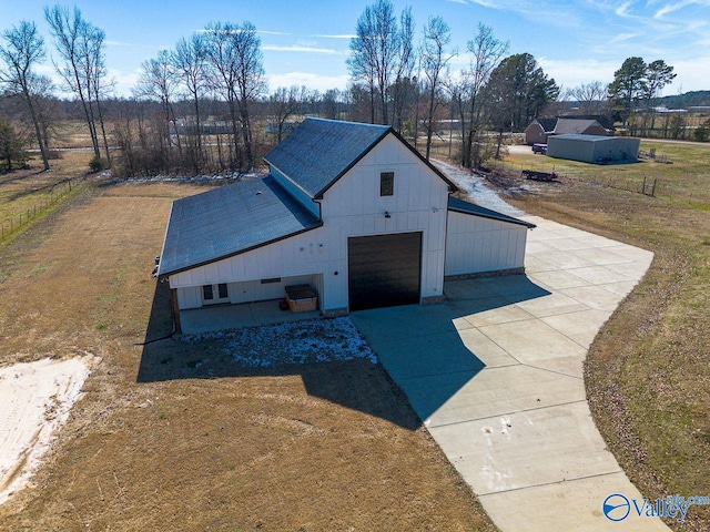 exterior space featuring driveway and a front lawn