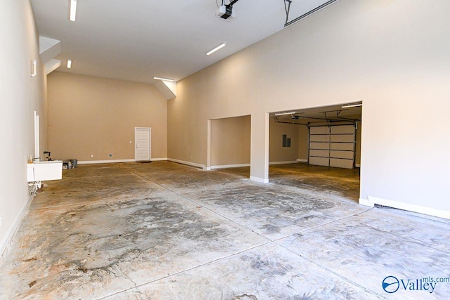 garage featuring baseboards and a garage door opener