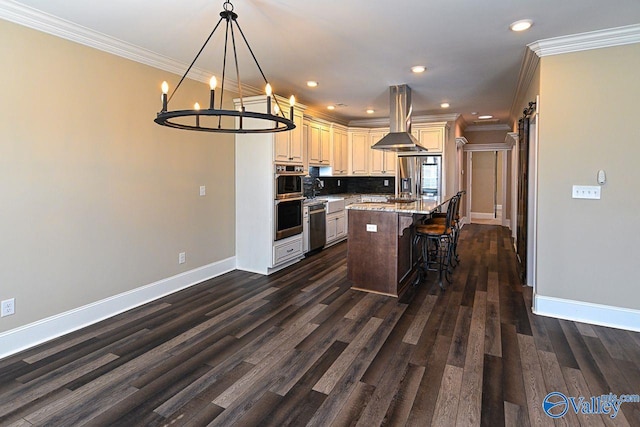 kitchen with light stone counters, a center island, island exhaust hood, a breakfast bar area, and stainless steel appliances