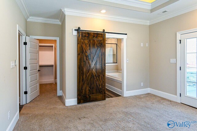 unfurnished bedroom with carpet floors, multiple windows, and ornamental molding