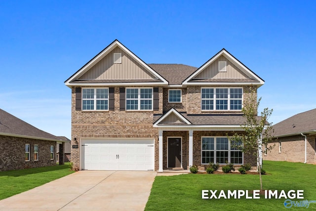 craftsman inspired home featuring a garage and a front yard